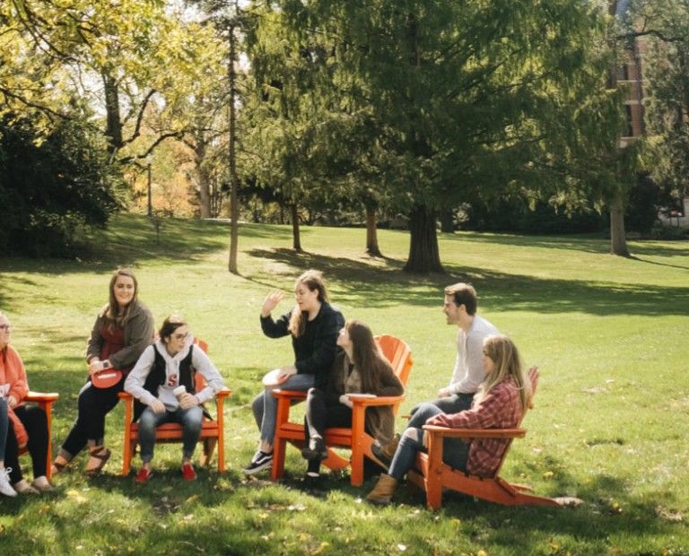 Student relaxing on the green