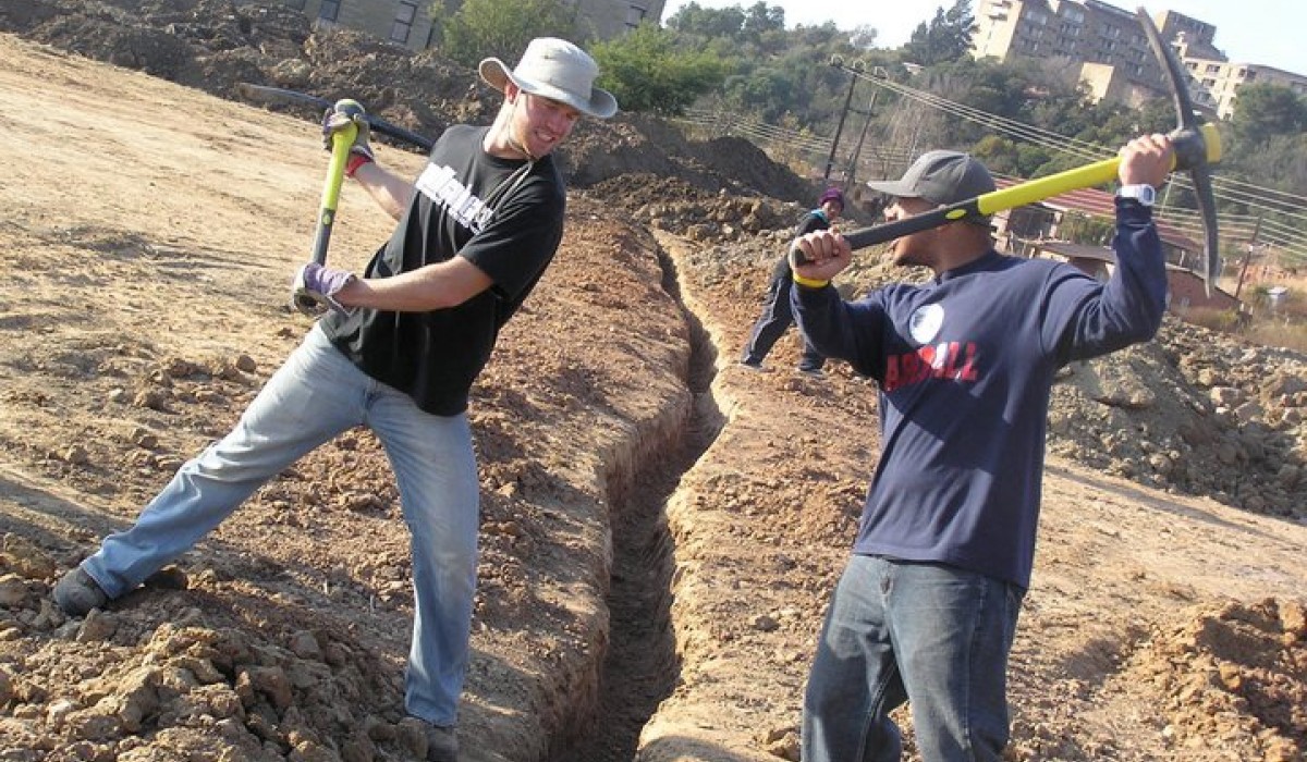 Students digging a trench