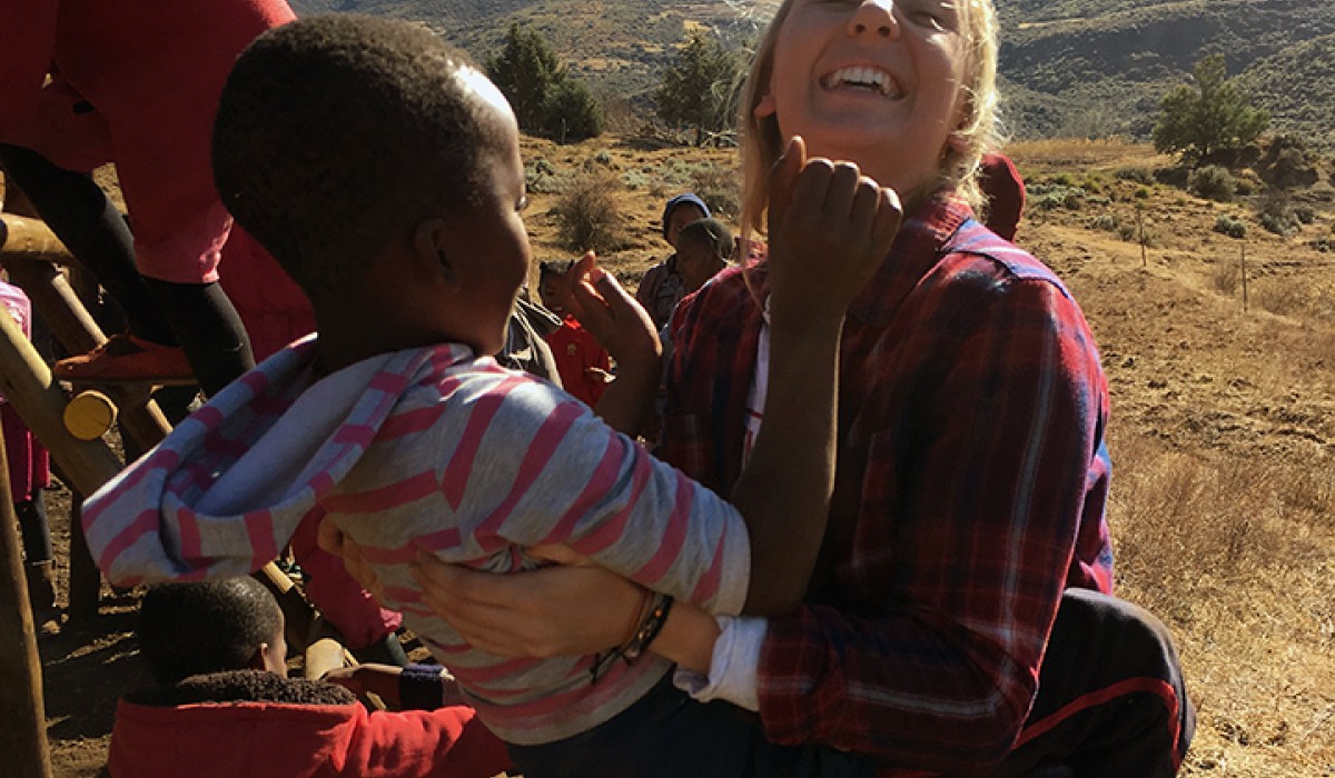 Student holding Lesotho orphan