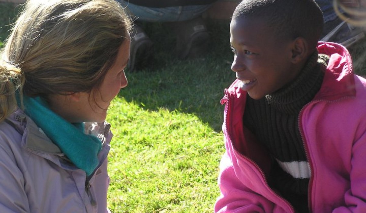 Student talking with orphan
