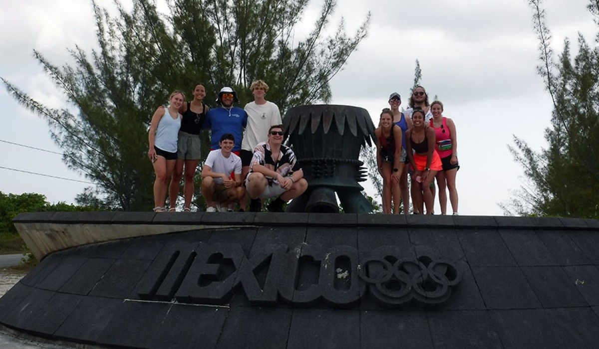 Students at the site where the Olympic flame landed on its way to Mexico City in 1968