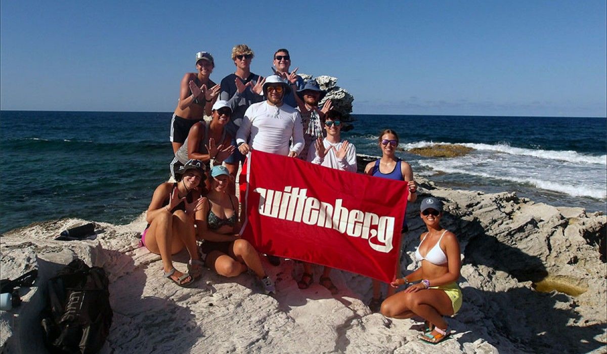 Wittenberg Students Holding Banner On Beach