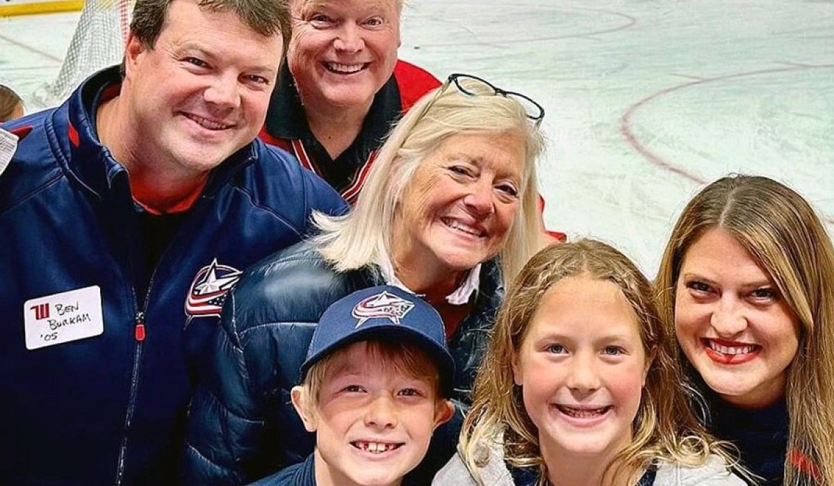 Jeff and Ann Burkam with son Ben ’05 and his family